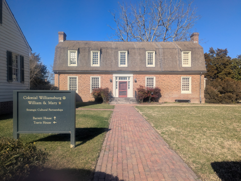 Photo of a large, colonial-era, two-story brick building.
