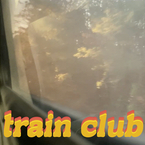 train club, leaves drift by outside train window